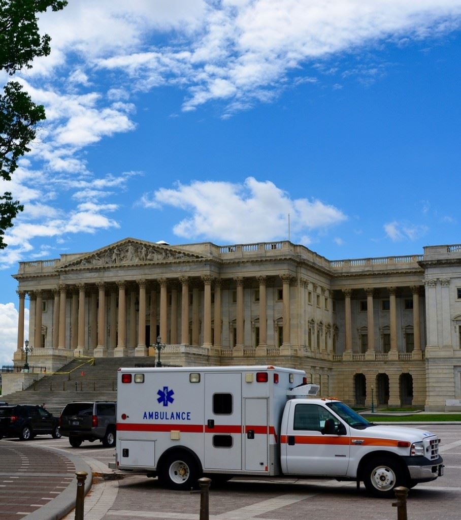 ambulance in front of a state building